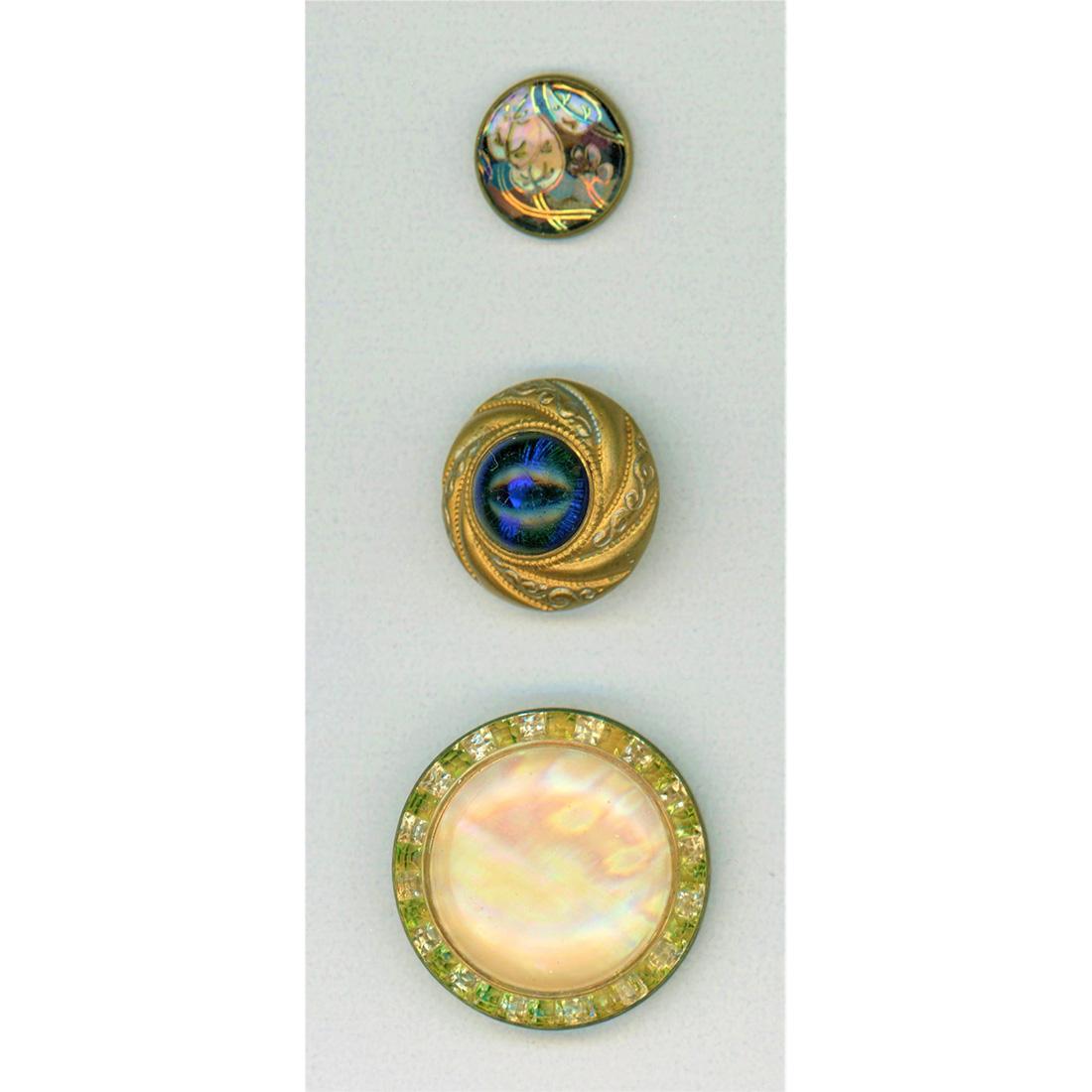 THREE DIVISION ONE DESIGN UNDER GLASS BUTTONS: 3 Small/Medium late 19th century DUG buttons. The design under glass buttons are a favorite of a lot of collectors. The small example in this lot is a reverse painted flower done in the French Eglomis