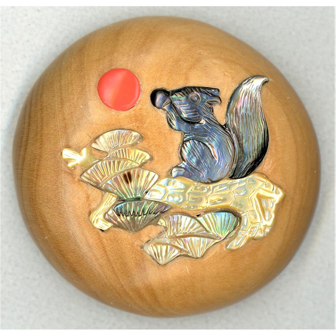 ONE DIVISION 3 WOOD AND SHIBAYAMA INLAY BUTTON: A large domed woof button with shell and coral inlay. This example imported from China in the late 1990's was created in the Japanese Shibayama technique and inlayed with pearl, abalone and coral. It