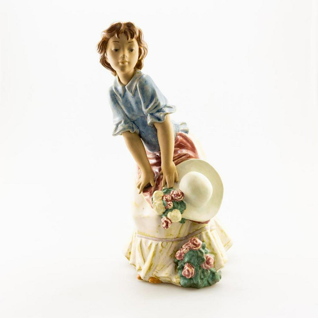 Lladro Figurine, Woman With Hat: Brunette girl posing with hat in hand. Gres; hand crafted. Lladro backstamp. Issued: 20th c. Dimensions: 13"H Manufacturer: Lladro Country of Origin: Spain