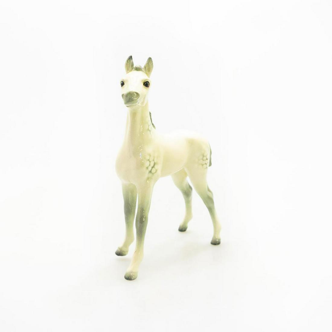 GOEBEL PORCELAIN FIGURINE DAPPLED WHITE HORSE: Gloss finish. Restoration to both back legs with hairline cracks. Goebel backstamp to underside. Issued: 20th c. Dimensions: 8"H Manufacturer: Goebel Country of Origin: Germany