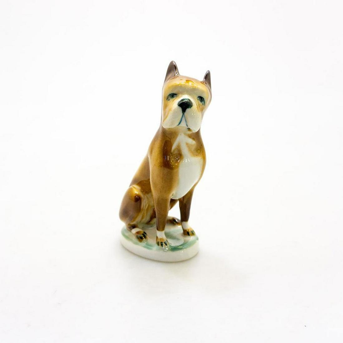 ZSOLNAY PORCELAIN BOXER FIGURINE: Brown and white seated male boxer. Issued: 20th c. Dimensions: 5.25"H Manufacturer: Zsolnay Country of Origin: Hungary