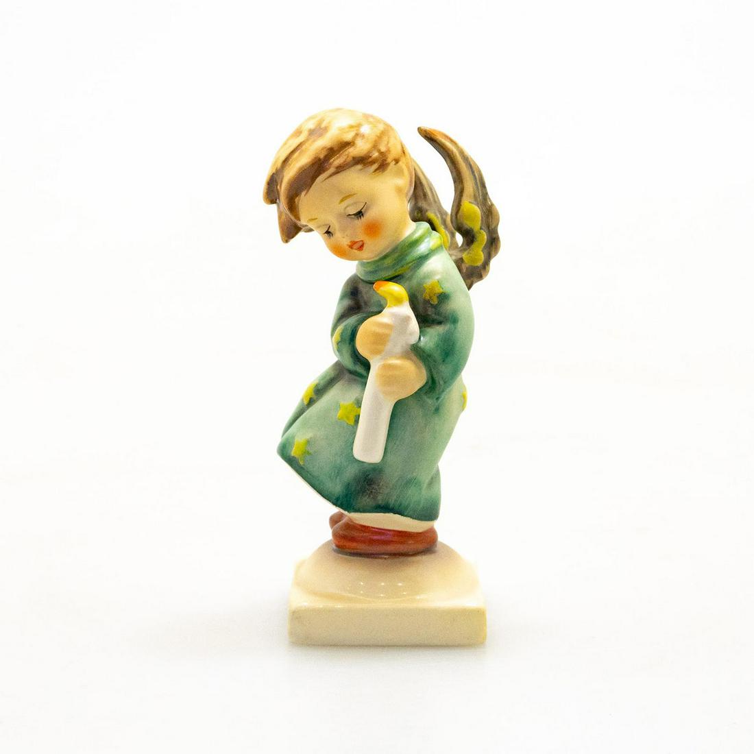 Goebel Hummel Figurine, Heavenly Angel: Hand painted porcelain, matte finish. Impressed M.I. Hummel to base. Title label to base. Impressed 27/0 to bottom base. Goebel backstamp. Marked W. Germany. Artist: M. I. Hummel Issued: 20th c. Dimen