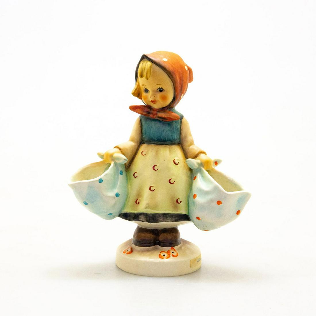 Goebel Hummel Figurine, Mother's Darling: Hand painted porcelain, matte finish. Impressed M.I. Hummel to round base with title label. Impressed 175 to bottom base. Goebel backstamp. Marked W. Germany. Artist: M. I. Hummel Issued: 20th c. Dime