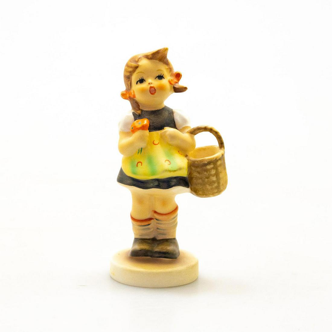 Goebel Hummel Figurine, Sister: Hand painted porcelain, matte finish. Impressed M.I. Hummel to round base. Flea bite chips to bottom base. Impressed 998/210 to bottom base. Goebel backstamp. Marked W. Germany. Artist: M. I. Hummel I