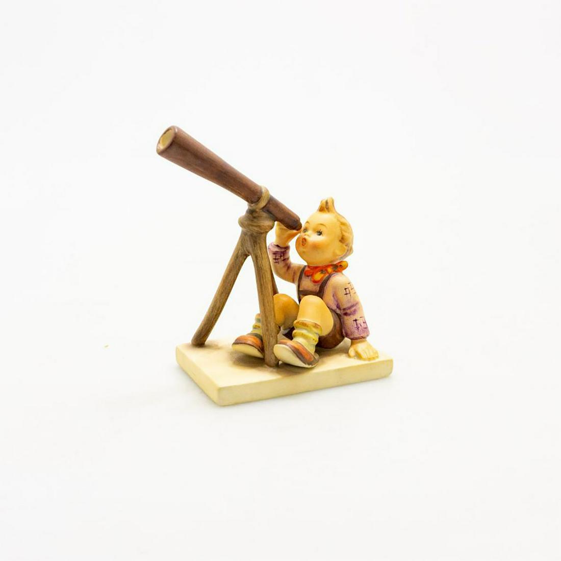 GOEBEL HUMMEL FIGURINE, STAR GAZER #132: A lad takes in a view of the heavens through his telescope. Issued: 20th c. Dimensions: 5"H Manufacturer: Goebel Country of Origin: Germany