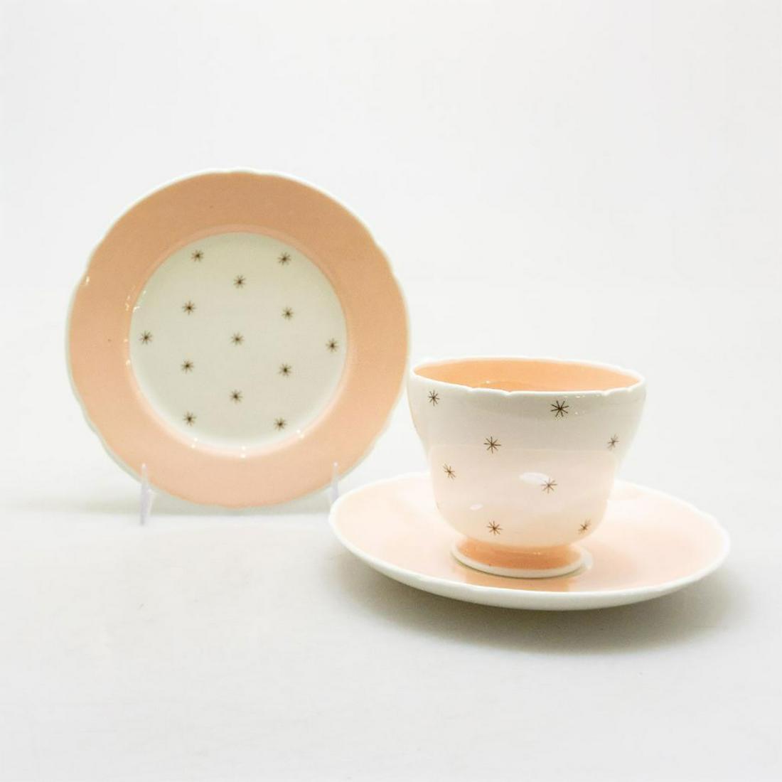 SHELLEY BONE CHINA ART DECO TEA TRIO, POLE STAR PATTERN: A vintage Shelley trio in the Pole Star style, marked with hard to find pattern 13774. Eggshell ground with soft milky pink pastel decoration and sandy fawn beige stars. SHELLEY FINE BONE CHINA ENGLAN