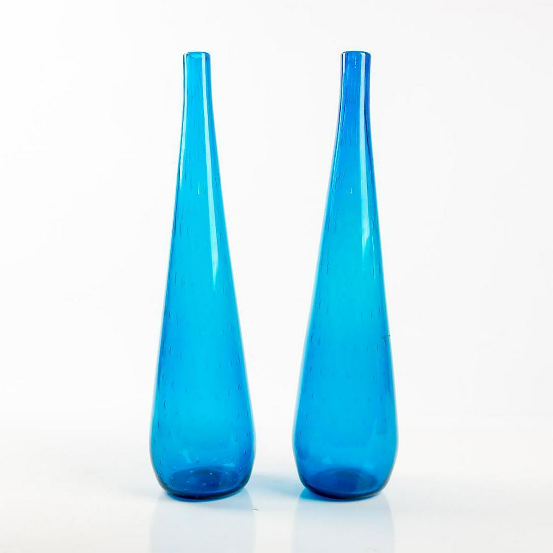 LARGE PAIR OF VINTAGE VASES IN BLUE: A large pair of vintage glass vases with fired bubbles floating up to tops of vases. Issued: 1960s Dimensions: 6"W x 22"H Country of Origin: USA Condition: good
