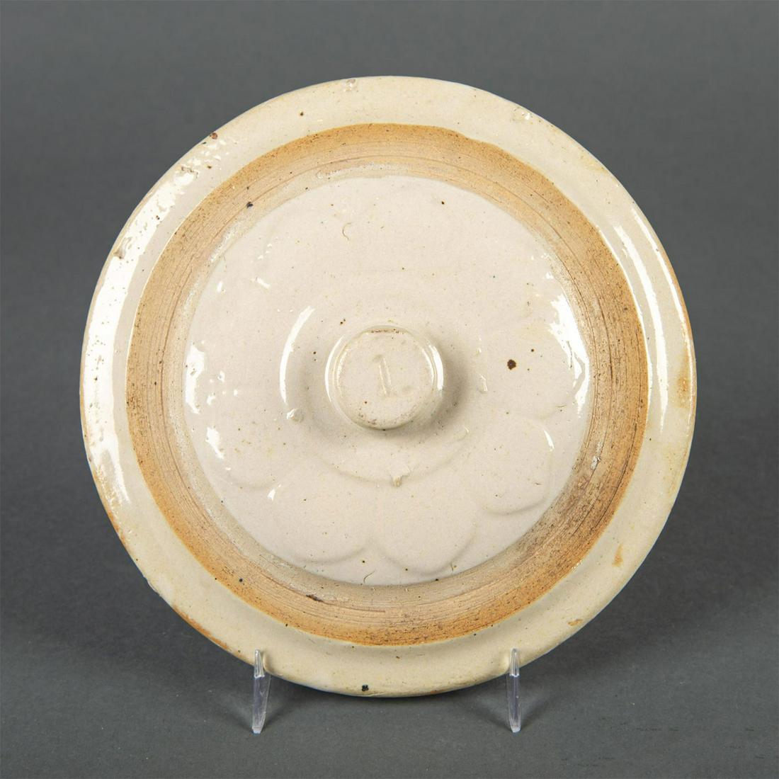 Red Wing Stoneware 1 Gallon White Petal Crock Lid: Salt glaze, few chips to underside. Age related wear. Issued: 20th century Dimensions: 5.75"dia. Manufacturer: Red Wing Stoneware Company Country of Origin: USA