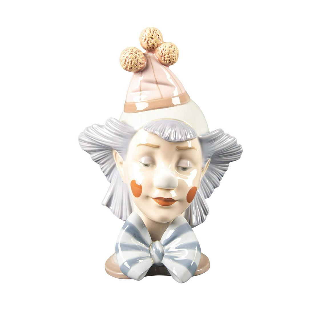 Lladro Clown Bust, Reflecting 01005612: Glossy hand painted porcelain. Lladro backstamp. W.box. Artist: Jose Puche Issued: 1988-1994 Dimensions: 9.5"H Manufacturer: Lladro Country of Origin: Spain