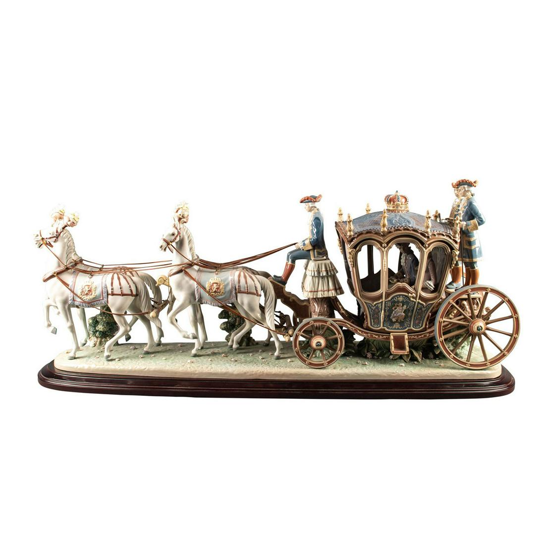 Lladro High Porcelain Xviiith Century Coach Sculpture: Majestic sculpture of horse drawn royal carriage with royal couple and footman. This great saloon in the Baroque style is inspired by the original models housed at the Coach Museum in Lisbon, and is o
