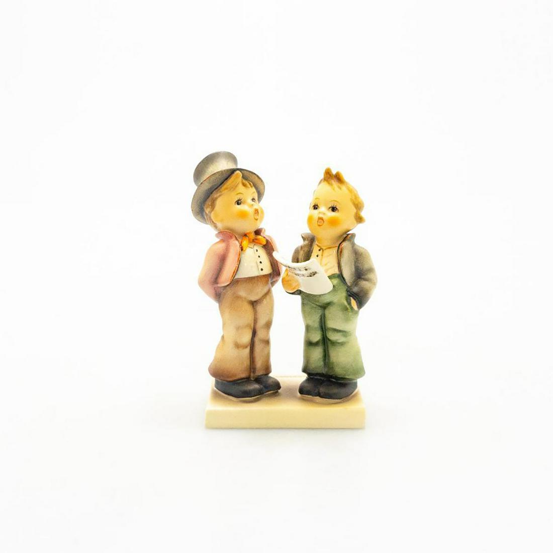 Goebel Hummel Figure, Duet 130: Ceramic; hand crafted; hand painted. two young boys singing together. Issued: 20th c. Dimensions: 4.75"H Manufacturer: Goebel Country of Origin: Germany
