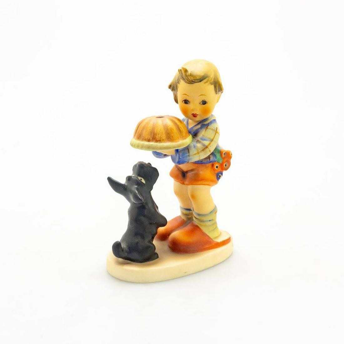 Goebel Hummel Figurine Begging His Share: Hand painted, depicts a dog begging for cake. Impress M.J. Hummel to top of base. Goebel backstamp. Marked 6 to bottom base. Issued: 20th c. Dimensions: 5.25"H Manufacturer: Goebel Country of Origin: