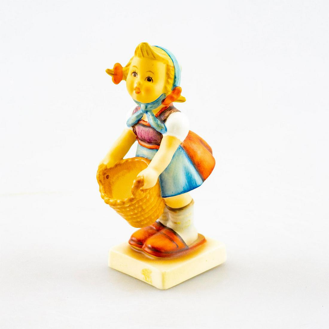 Goebel Hummel Figurine Little Helper 73: Girl holding empty bucket. Goebel backstamp. Issued: 20th C. Dimensions: 4" tall Manufacturer: Goebel Hummel Country of Origin: Germany