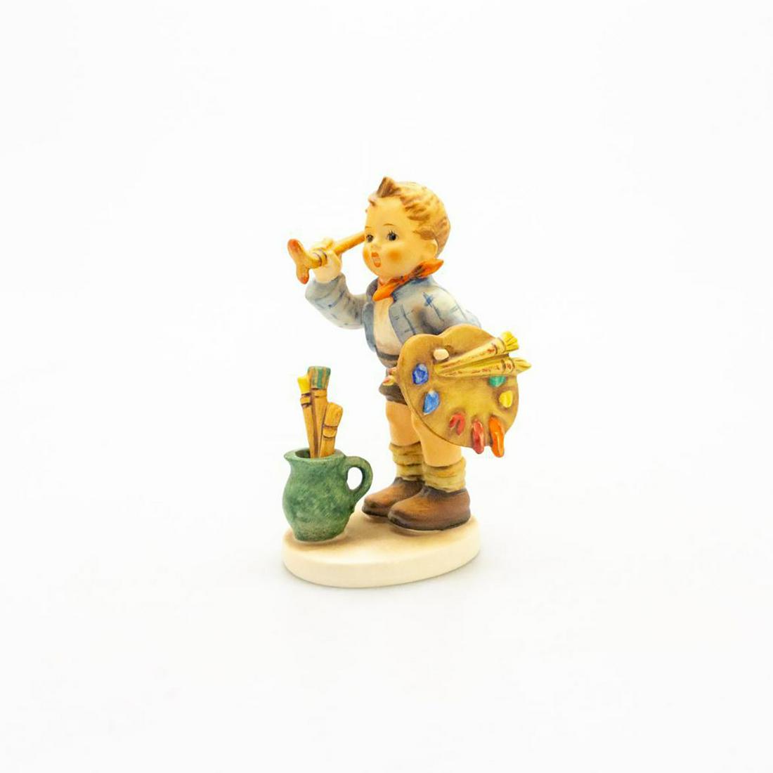 Goebel Hummel Figurine The Artist: Hand painted, impressed M.J. Hummel to back of base. Goebel backstamp. Marked 304 1955 to bottom of the base. Minor age related crazing. Issued: 20th c. Dimensions: 5.75"H Manufacturer: Goebel Country