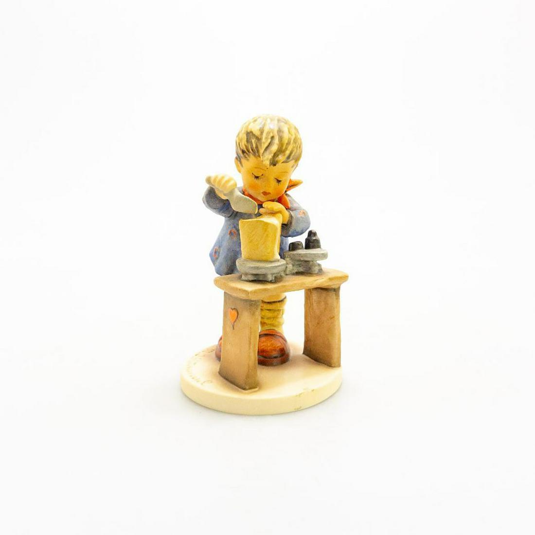 Goebel Hummel Figurine, A Fair Measure 345: Handcrafted; hand painted. Ceramic. Goebel backstamp. Crazing to base. Issued: 20th c. Dimensions: 6"H Manufacturer: Goebel Country of Origin: Germany