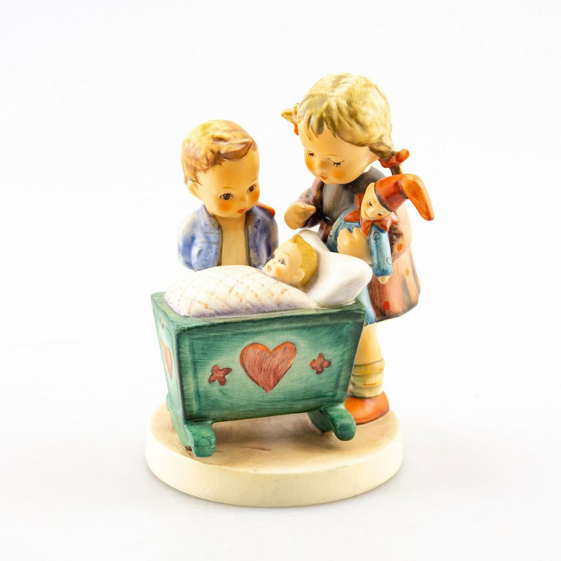 Goebel Hummel Figurine, Blessed Event 333: Young children with a new born baby. Handcrafted; hand painted. Goebel backstamp. Issued: 20th c. Dimensions: 5.5"H Manufacturer: Goebel Country of Origin: Germany