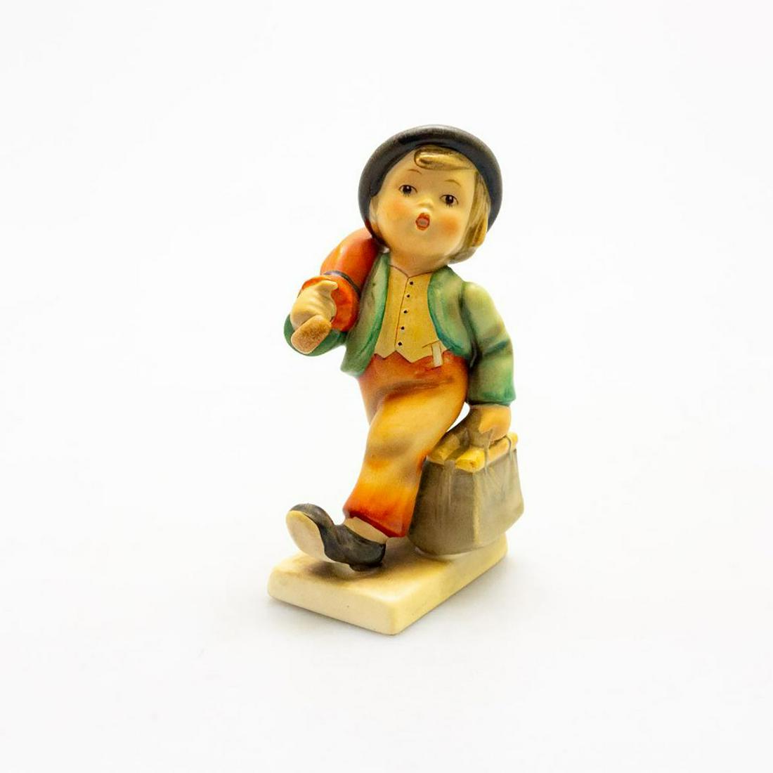 Goebel Hummel Figurine, Merry Wanderer #11/0: With a pep in his step, this fellow carries a bag and umbrella. Issued: 20th c. Dimensions: 5.5"H Manufacturer: Goebel Country of Origin: Germany