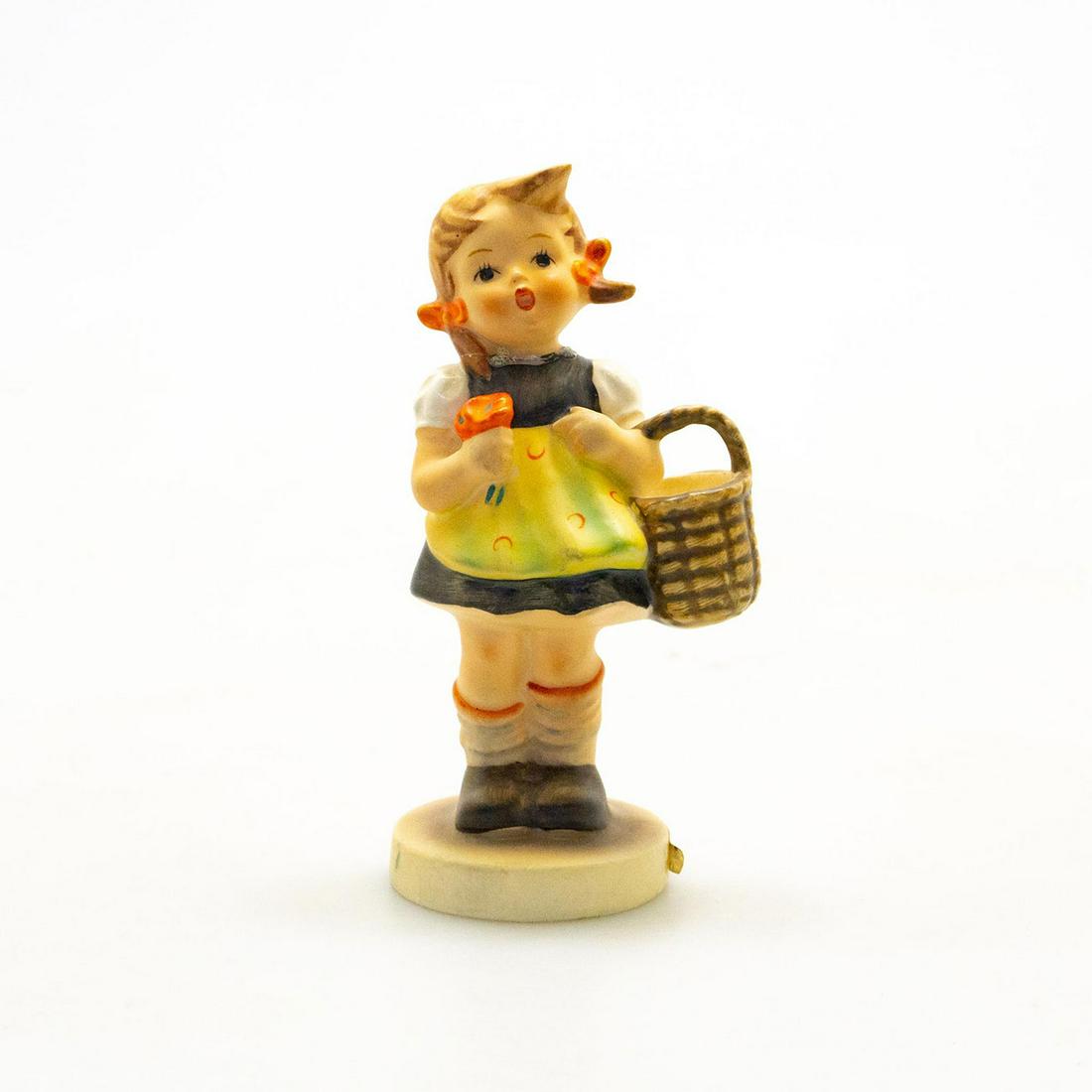 Goebel Hummel Figurine, Sister 98: Hand painted porcelain; young girl figure. Title label on base. Goebel backstamp. Issued: c. 1962 Dimensions: 4.75"H Manufacturer: Goebel Country of Origin: Germany