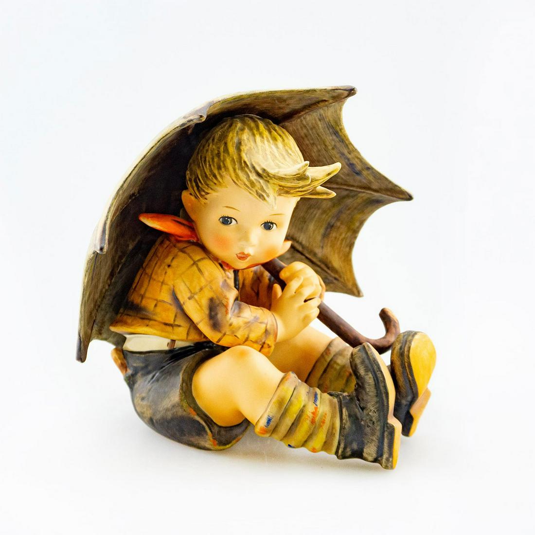 Goebel Hummel Figurine, Umbrella Boy 152: Large size. Young boy holding an umbrella. Hand crafted. Goebel backstamp. Issued: 20th c. Dimensions: 7.75"H Manufacturer: Goebel Country of Origin: Germany