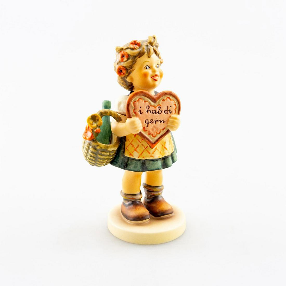 Goebel Hummel Figurine, Valentine Gift 387: Young girl holding a heart. Hand crafted; hand painted. Goebel backstamp. Issued: 20th c. Dimensions: 5.75"H Manufacturer: Goebel Country of Origin: Germany