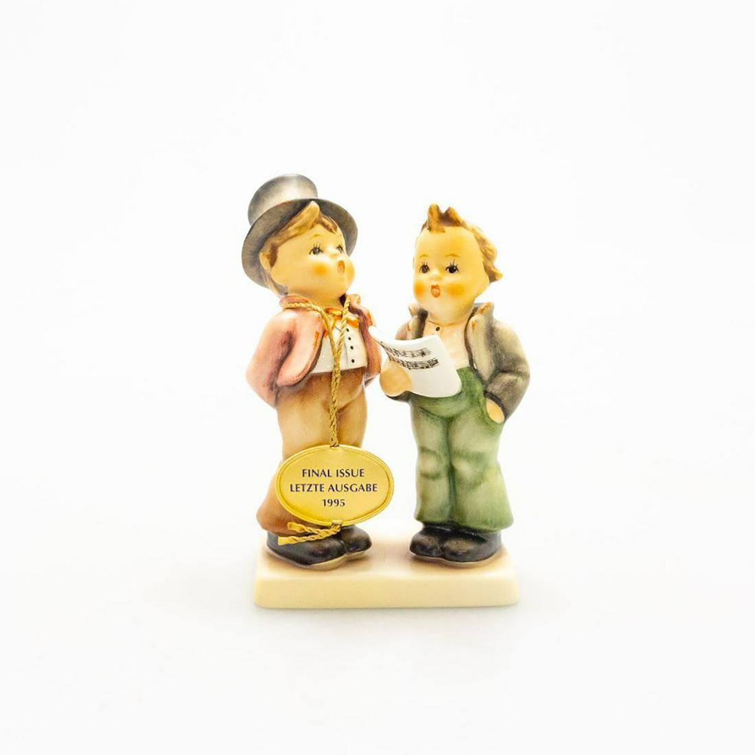 Goebel Hummel Group Figurine Duet: Hand painted, depicts two boys singing with sheet music. Bottom base marked Final Issue Letzte Ausgabe 1995. Goebel backstamp. Marked 130. Issued: 20th c. Dimensions: 5.25"H Manufacturer: Goebel Count