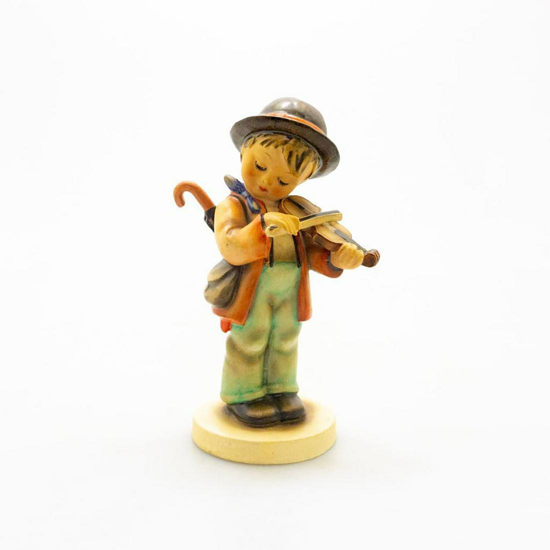 Rare Goebel Hummel Figurine, Little Fiddler 2: Ceramic figure; hand painted. Young boy playing a violin. Marked MADE IN US-ZONE, GERMANY. Issued: 20th c. Dimensions: 6.75"H Country of Origin: Germany