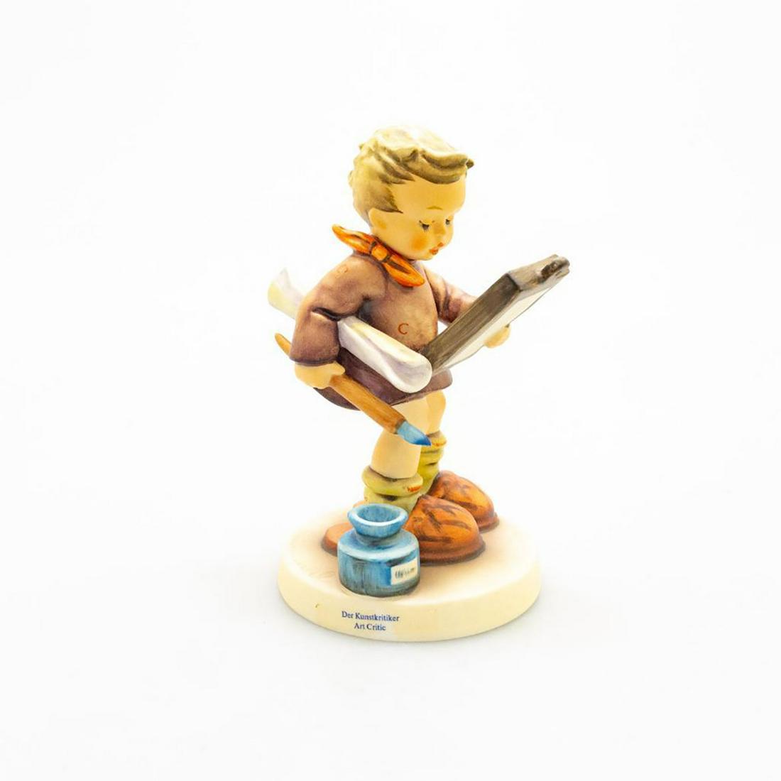 Vintage Goebel Hummel Figurine, #318: A young boy with paint brush in hand reviews his artwork. Issued: 1955 Dimensions: 5.75"H Manufacturer: Goebel Country of Origin: Germany