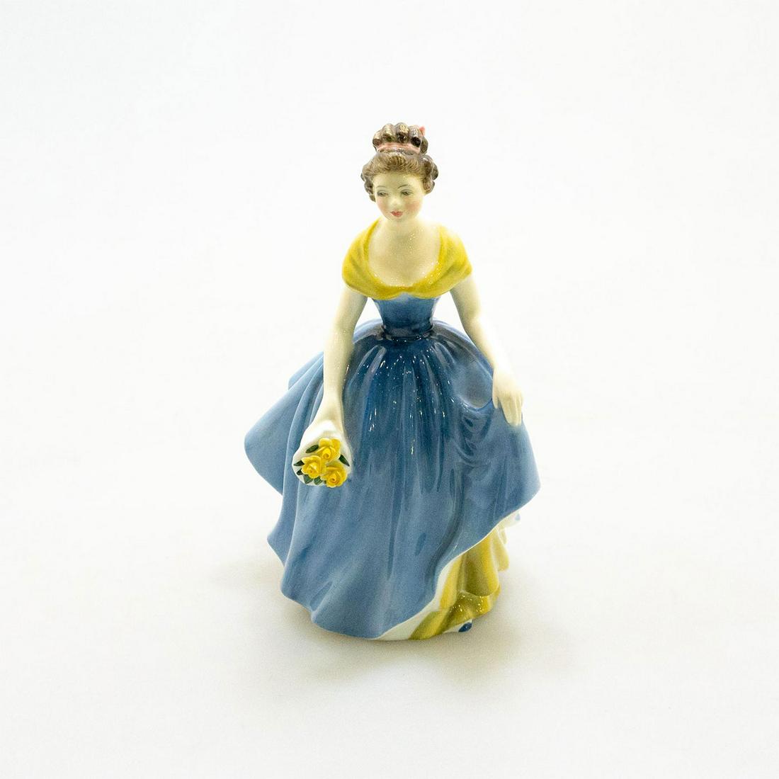 Royal Doulton Melanie Hn2271 Fashion Porcelain Figure: Dressed in a summer gown in shades of blue with yellow trim on shoulders, holding bouquet of yellow roses. #yellowroses #summergown Artist: Peggy Davies Issued: 1965 Dimensions: 7.75"H Country of Orig