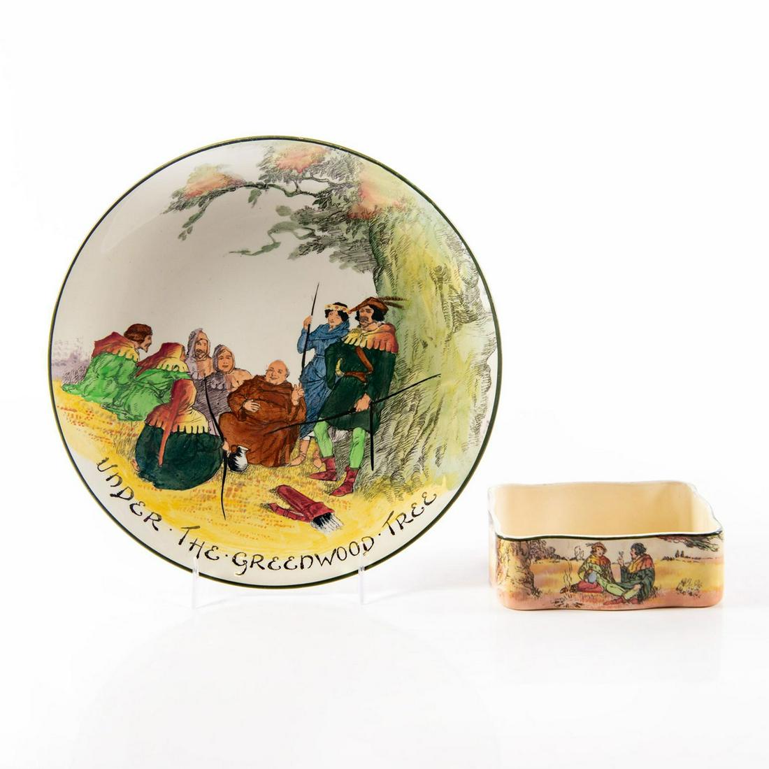 Royal Doulton Plate + Trinket Dish, Under Greenwood: Plate features a colorful vibrant scene of Robin Hood, Maid Marian, Friar Tuck and some Merry Men. From the Under The Greenwood Tree series 9"H. Trinket dish features Little John and Alan-A-Dale sitti