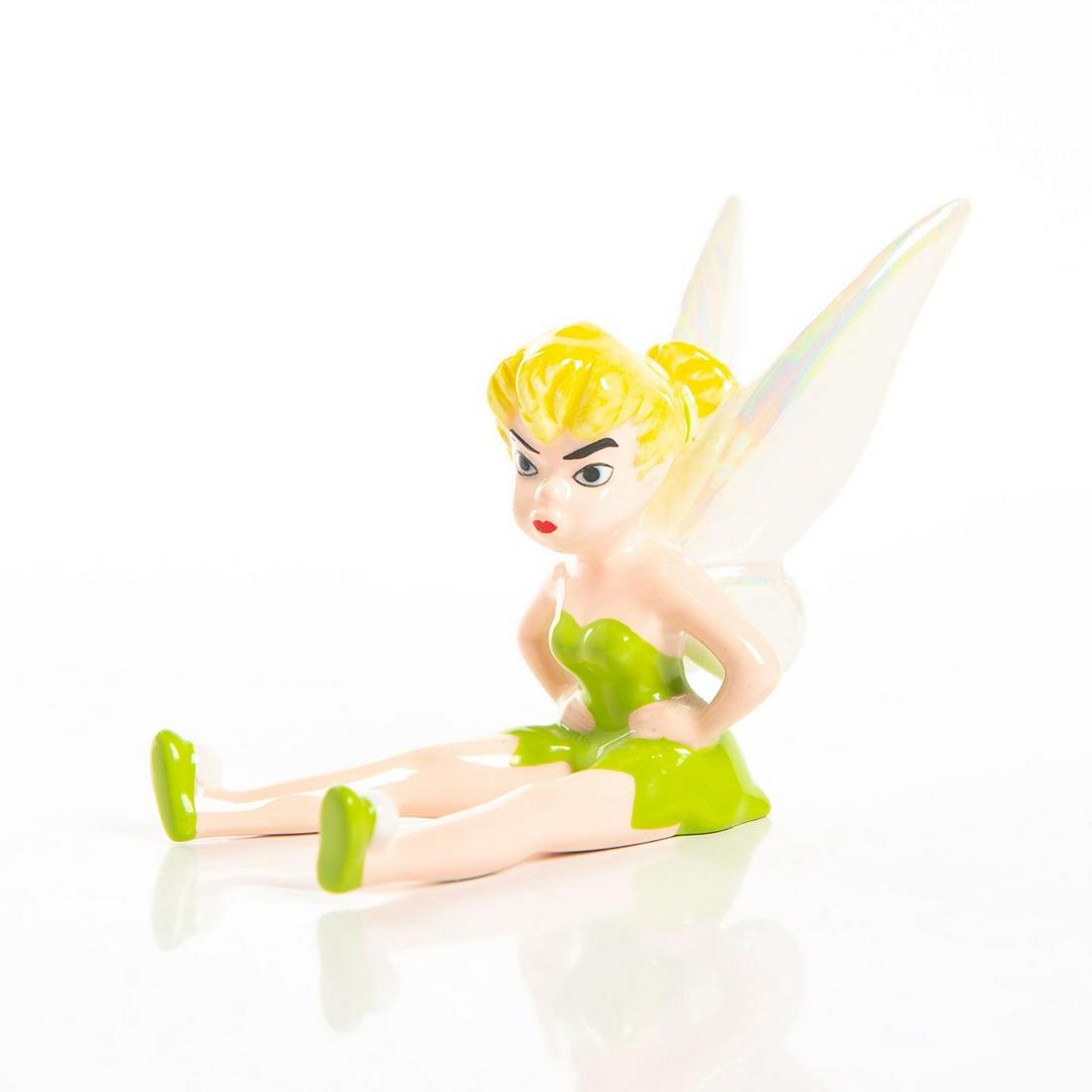 Ceramic Figurine, Disney Tinker Bell: Tinker Bell sitting with arms akimbo. Issued: 20th c. Dimensions: 2.5"H Country of Origin: China Manufacturer: Disney
