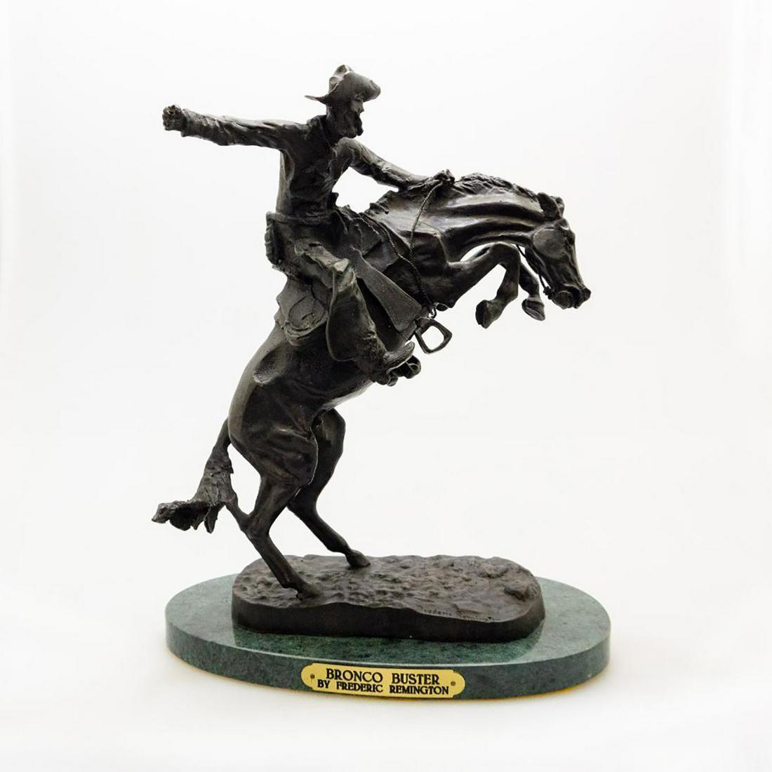 Frederic Remington Bronco Buster Statue Reproduction: After Frederic Remington 1861- 1909, The Bronco Buster sculpture. Sculpture mounted on base. Portrays a rugged Western cowboy fighting to stay aboard a bronco. The original piece was given to Presiden
