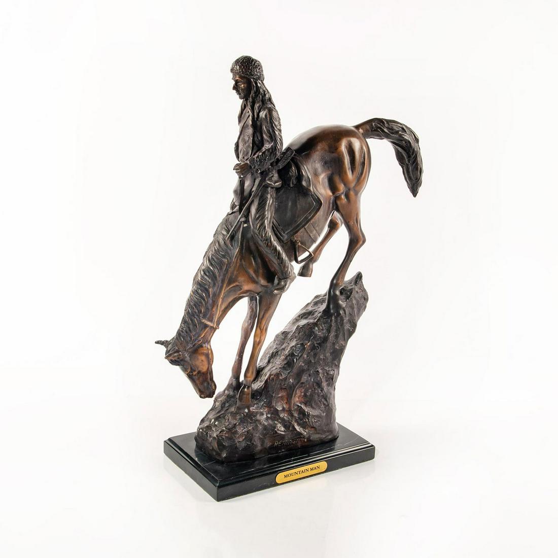 Large Bronze Sculpture, The Mountain Man: Western themed sculpture after Frederic Remington. Mountain man riding a horse down a steep and treacherous rocky mountain slope. Extremely detailed piece; piece made through the lost wax casting proc