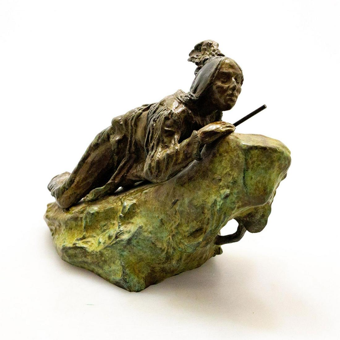 Bronze Sculpture, Native American Indian Warrior Scout: An Indian warrior on a rocky outcrop, modeled in a naturalistic style. Artist signed. An early 20th century bronze sculpture by Austrian artist Carl Kauba (1865-1922), rich antique brown with a green 