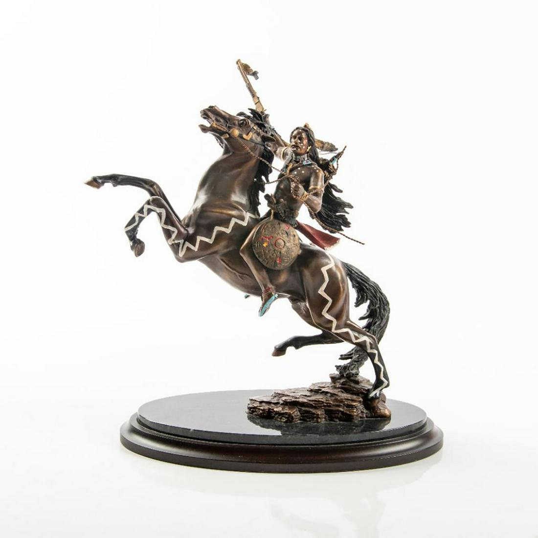 Franklin Mint Bronze Figure, Warrior Of Destiny: Finely crafted Native American man on horse back holding his rifle high. Handpainted cast bronze statue; mounted on marble base. Labeled to the underside with title; signed R. F. Murphy. Artist: Rober
