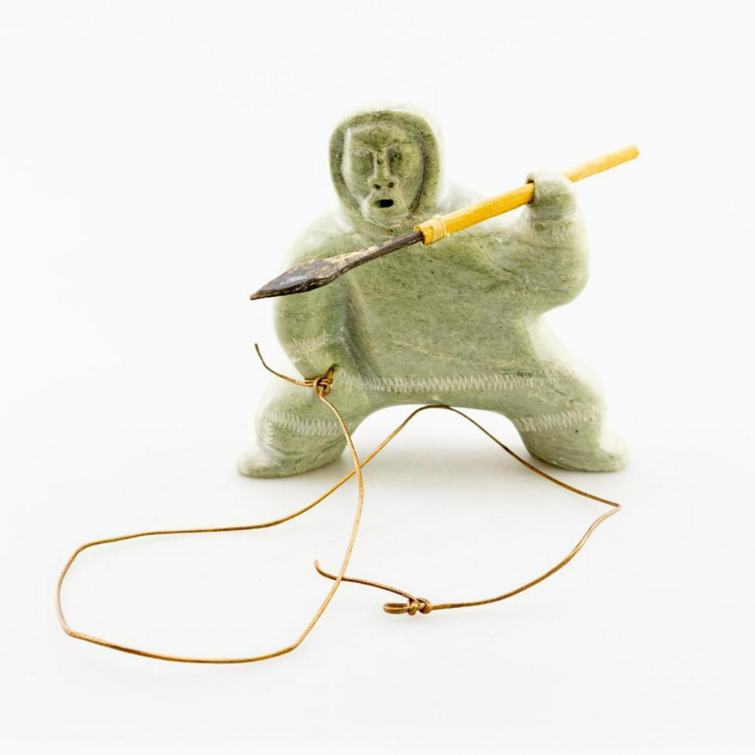 Inuit Soapstone/Regional Stone Figurine Sculpture,: Light green hand carved stone with other natural materials. Lustrous green stone with inclusions, hand carved as a spear fisher hunter with separate wooden spear. Artist signed. #Sculpture #InuitCarvi