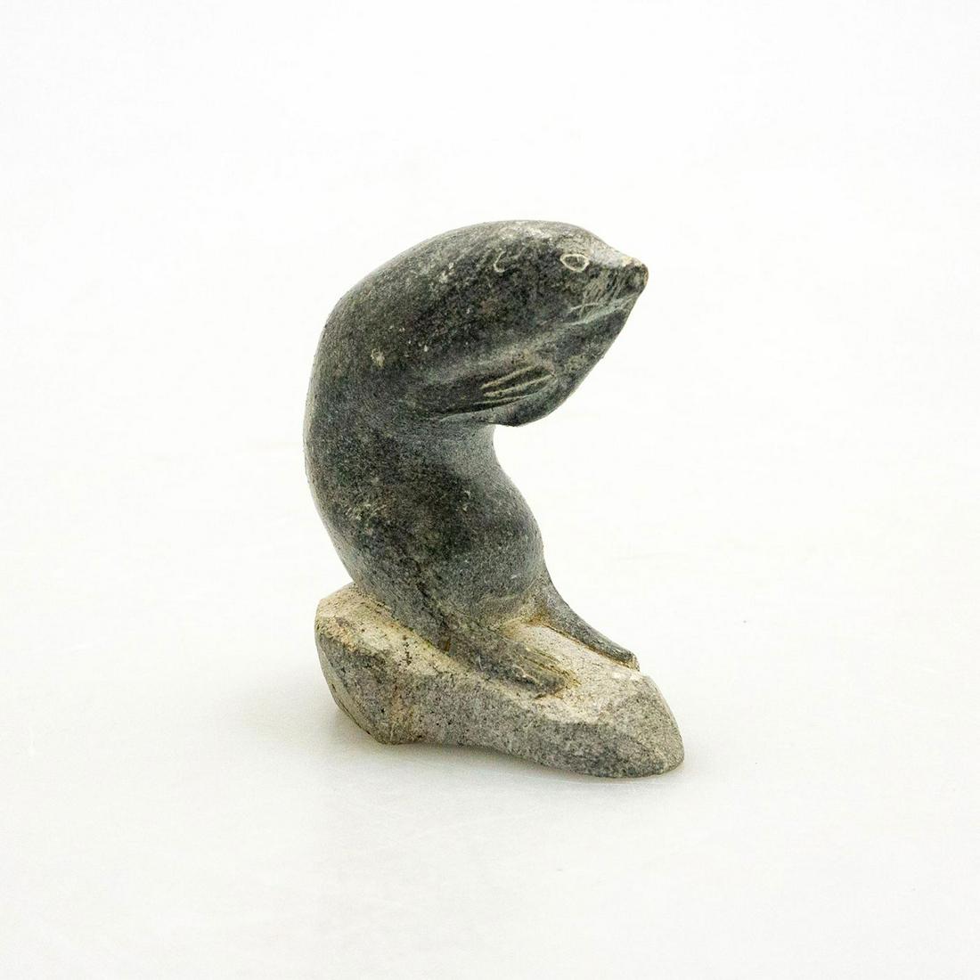 Inuit Tribal Soapstone/Regional Stone Figurine: A vintage hand carved seal eats a tasty fish. Dark gray stone with incised details. #InuitArt #NativeCanadians #Soapstone #SeaLions #Sculptures #EskimoSculpture #VintageArt Issued: c. 1960 Dimensions: