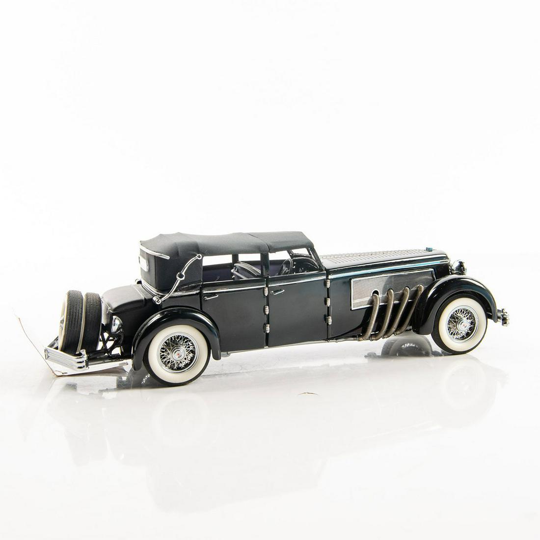 Franklin Mint Precison Model Car: Depicts a 1940 Duesenberg SJ convertible town car. Die-cast model. Issued: 20th c. Dimensions: 2.75"H x 9.75"L Manufacturer: Franklin Mint Precision Country of Origin: USA