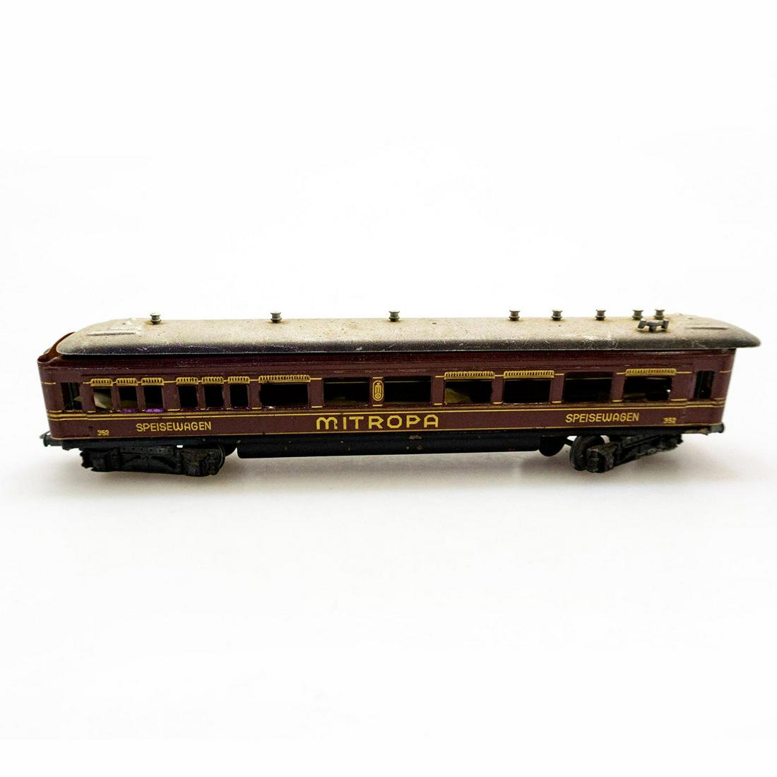 Marklin Mitropa Speisewagen Model Train, 352 Dining Car: Vintage HO scale Marklin Pressed Steel Wine Red with Gold Lettering, Mitropa Dining Car, Speisewagen . Issued: 20th c. Dimensions: 2.25"H x 9.5"L Manufacturer: Marklin Country of Origin: Germany