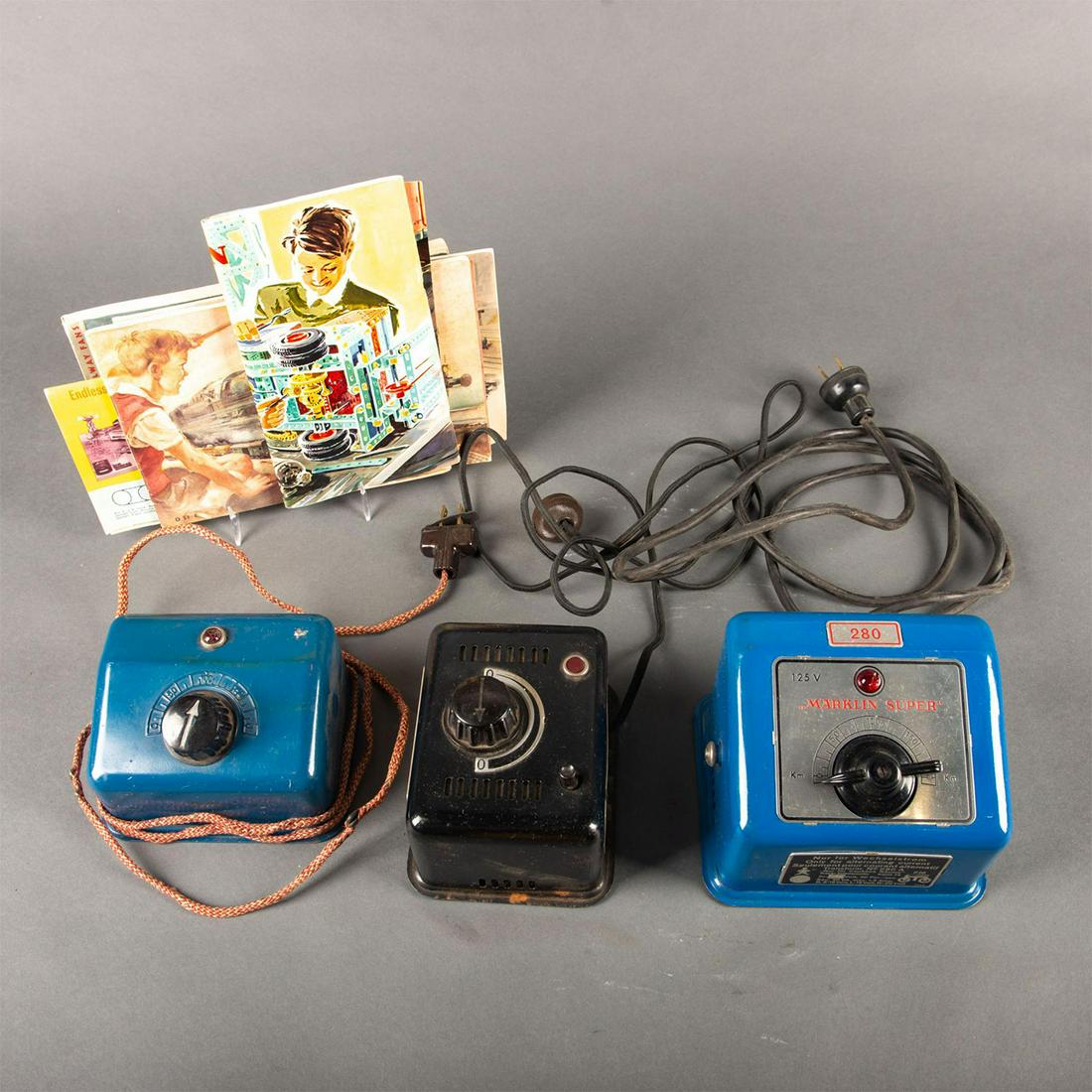 3 Vintage Germany Collectible Model Train Transformers: Includes a Marklin Super 280, 125 volt and a Transformer 270, 110. Complete with 5 Marklin booklets. Issued: 20th c. Dimensions: 5"W x 4.5"H Country of Origin: Germany