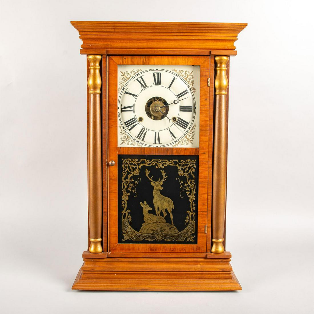 Seth Thomas Walnut Chiming Mantel Clock: Walnut case; double glass door with reverse painted scene with deer. Includes winding key. Running. Age related wear. Issued: c. 1900 Dimensions: 16"W x 25.25"H Manufacturer: Seth Thomas Clock Company