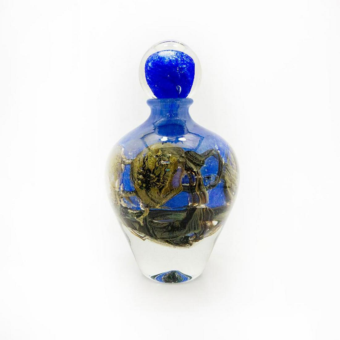 Jean-Claude Novaro Lg Blue Glass Bottle Art With Dauber: Blown-glass on blue ground with golden blown formations along the body. Finished with spherical dauber. Signed and dated to bottom base. Artist: Jean-Claude Novaro Issued: 2005 Dimensions: 9.5"H Manuf