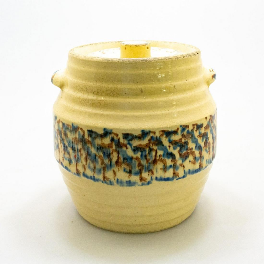 Beehive Ribbed Stoneware Covered Crock: Covered stoneware crock with dbl handles and a banded sponged center decoration. Issued: 20th century Dimensions: 9.75"H x 24" dia. Manufacturer: Red Wing Country of Origin: USA