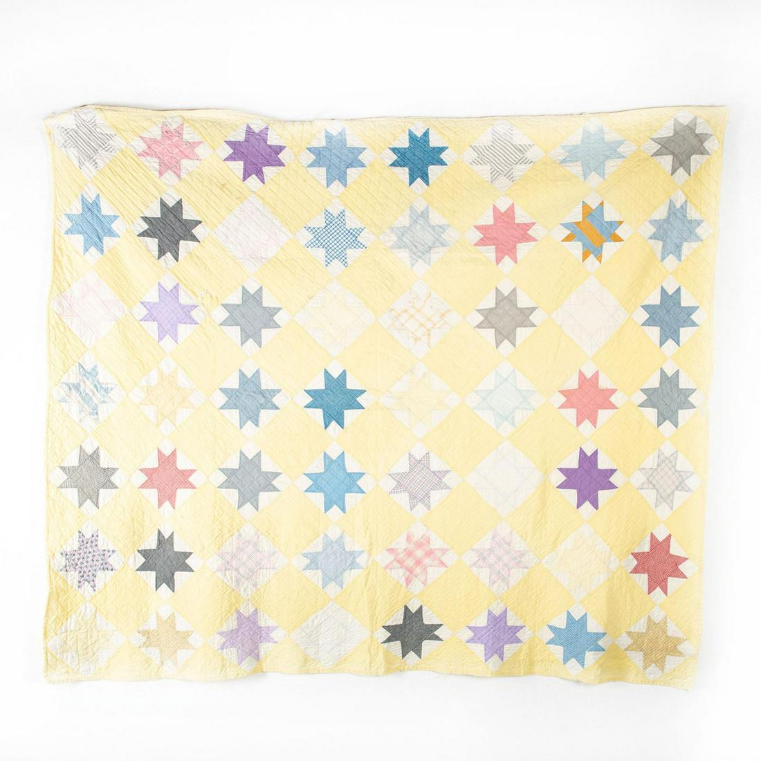 Large Big Star Quilt, Hand Sewn: 8 point star designs on pale yellow with cream backing, pastel coloration. Age related stains and rips along border. Issued: 20th c. Dimensions: 71"L x 80.5"H Country of Origin: USA