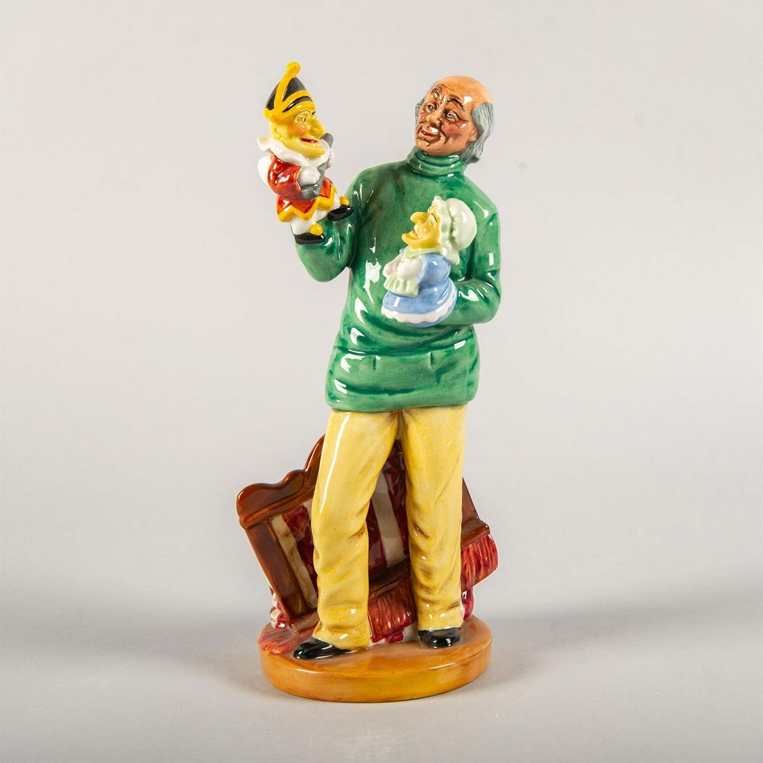 Punch and Judy Man HN2765 - Royal Doulton Figurine: Part of the Literary Characters series collection. Royal Doulton backstamp. Artist: William K. Harper Issued: 1981 - 1990 Dimensions: 9"H Manufacturer: Royal Doulton Country of Origin: England