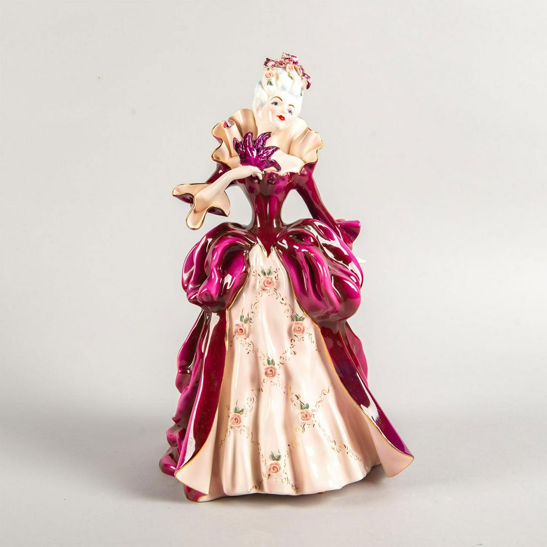 Florence Ceramics Figurine, Madame Pompadour: Lg porcelain; vibrant colors; intricate pink rose detail on dress; gilt accents. Florence Ceramics backstamp. Issued: 20th c. Dimensions: 12.5"H Manufacturer: Florence Ceramics Country of Origin: Unit