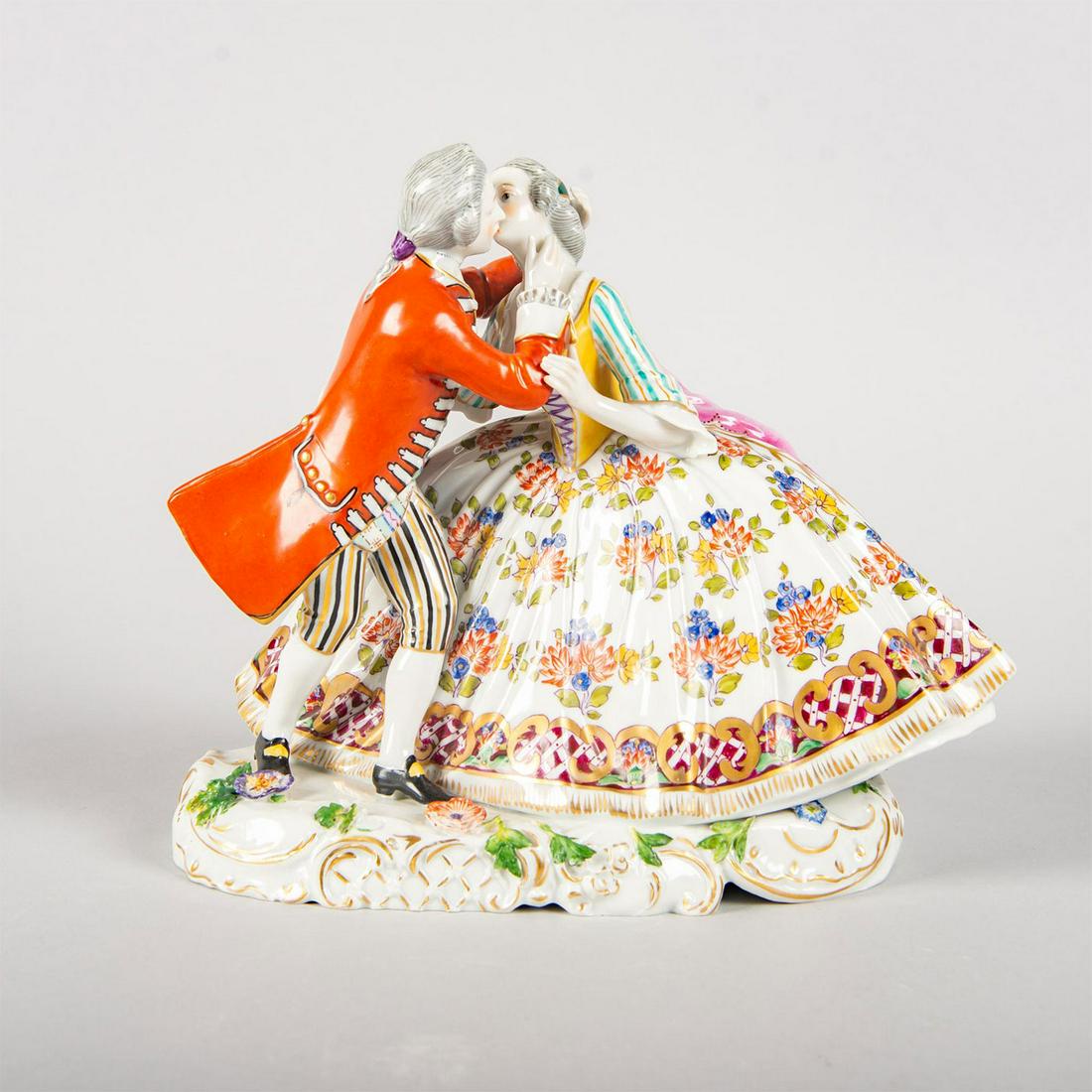 Vintage Wilhelmsfeld Figure Group, Couple Kissing: Hand painted; polychrome floral design on gown; gilt highlights. Wilhelmsfeld backstamp. Issued: 20th c. Dimensions: 7.5"H Manufacturer: Wilhelmsfeld porcelain Country of Origin: Germany