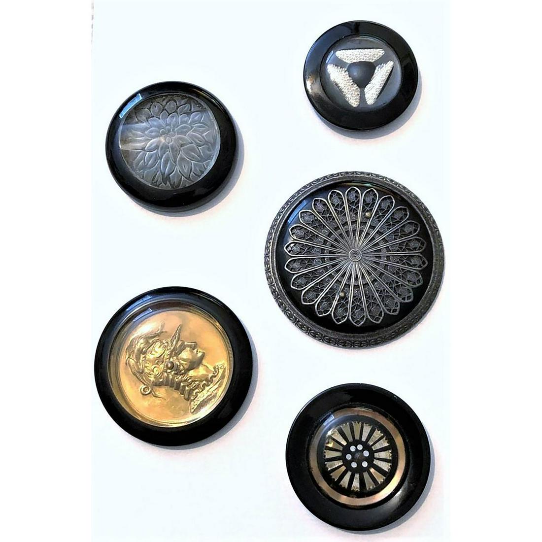 Two Small Cards Of Division 3 Bakelite Buttons: 9 Large and extra large Bakelite buttons from the mid 20th C. This lot includes glass and Lucite centers, brass escutcheons, a black glass precision inlay center, a Mock Tortoise, and more. Issued: DI