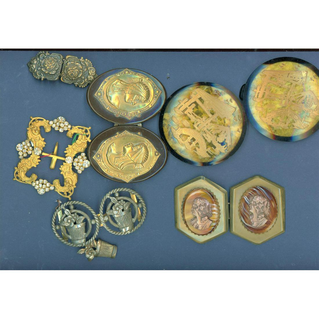 A Small Card Of Older Assorted Buckles: 6 one and two piece buckles including celluloid. This lot includes Bakelite based heads, celluloid tight top, brass gilded and paste OME and more. Issued: DIVISION 1=PRE 1918 AND DIVISION 3 IS AFTER 1