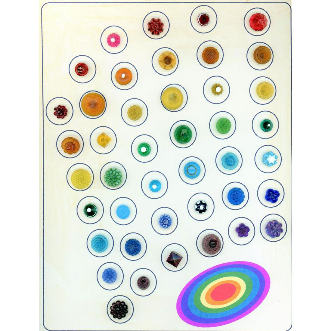 1 1/2 Cards Of Clear & Colored Glass Swirlback Buttons: 65 19th century colored glass buttons with swirlbacks. These colorful gems of buttons come with a variety of molded tops and designs. Included is a partial card of black glass examples. Issued: DIVISI