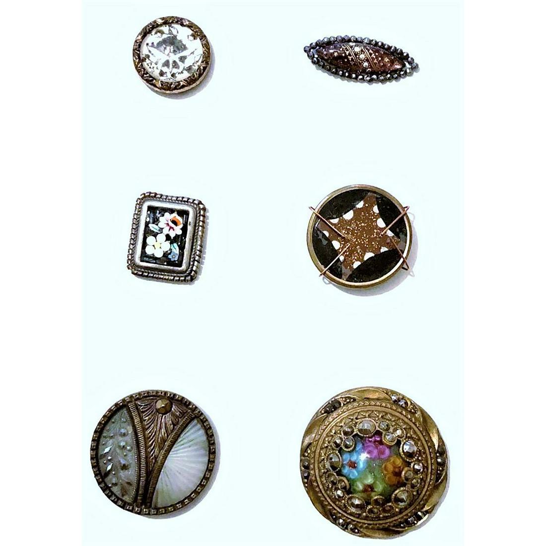 A Small Card Of Glass Set In Metal Buttons: 6 small and medium metal buttons with glass centers. Includes is a multi colored glass centered Gay 90 with cut steels, a dived opalescent glass mounted in metal, an Italian mosaic set in silver, a pu